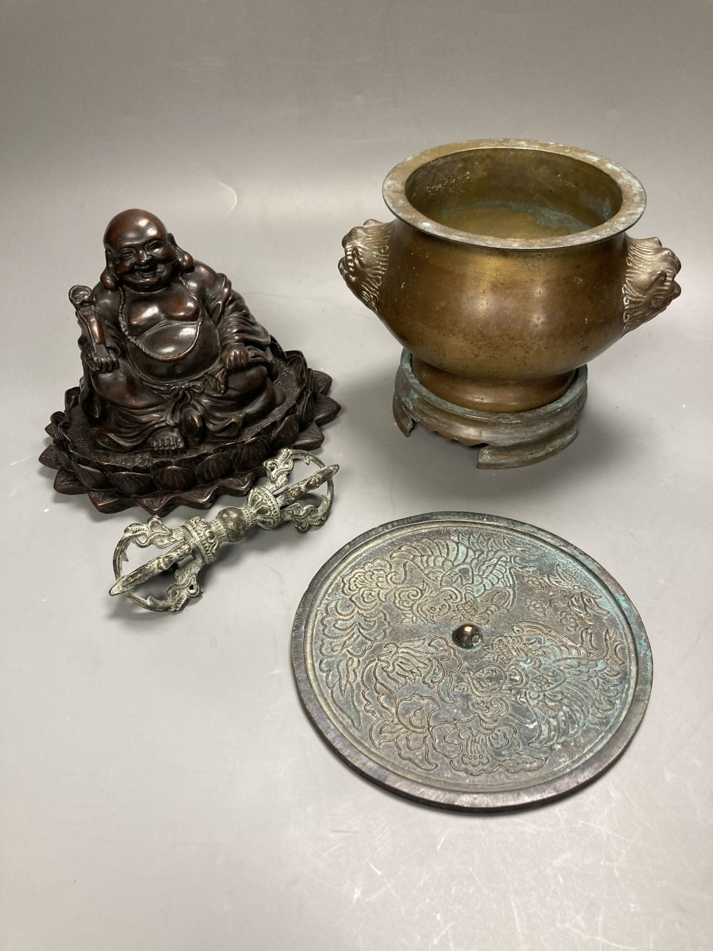 A Chinese bronze censer and stand, 14cm high, a bronze vajra sceptre, a mirror and a composition Buddha